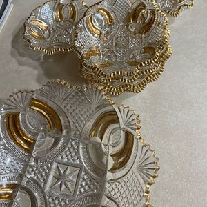 Beautiful glass fruit bowl and 6 serving bowls. No chips. Gold accents.
